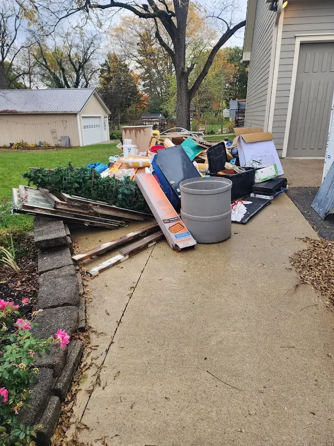 Dumpster being loaded with debris for 3 Yard Dumpster Rental in Shrewsbury